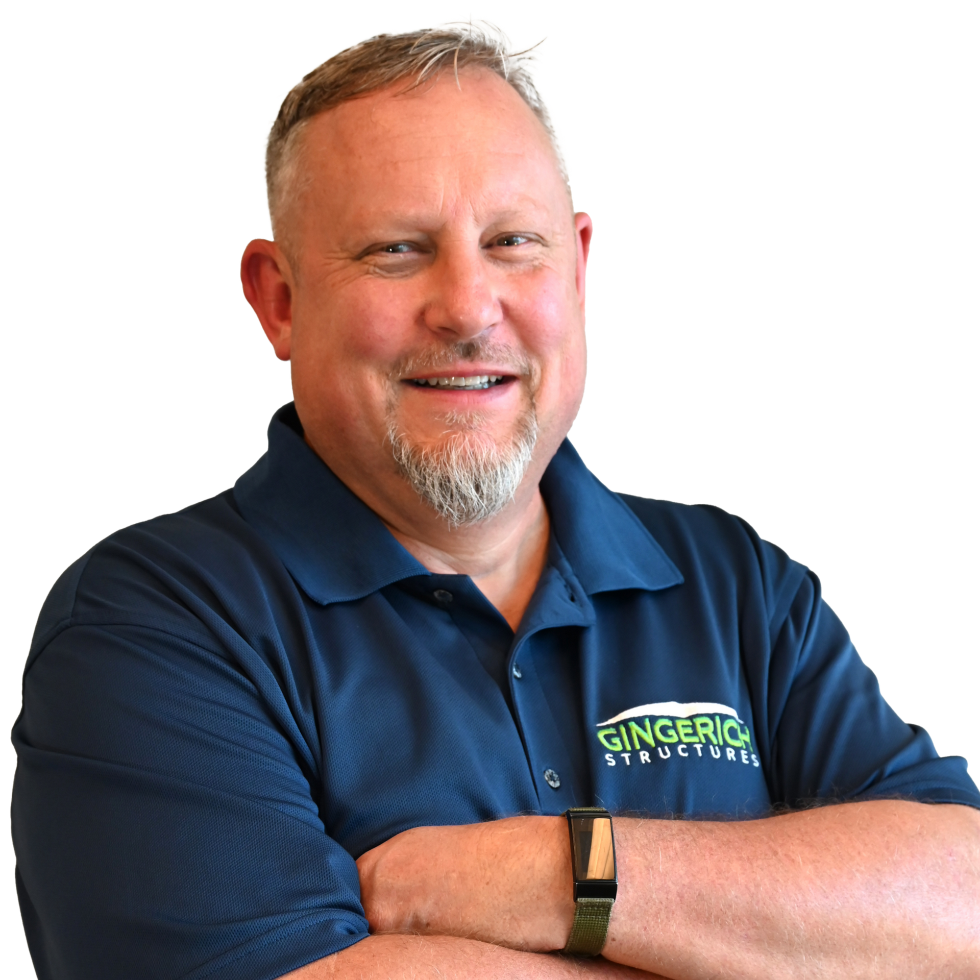 Man with arms crossed, wearing a blue polo shirt with