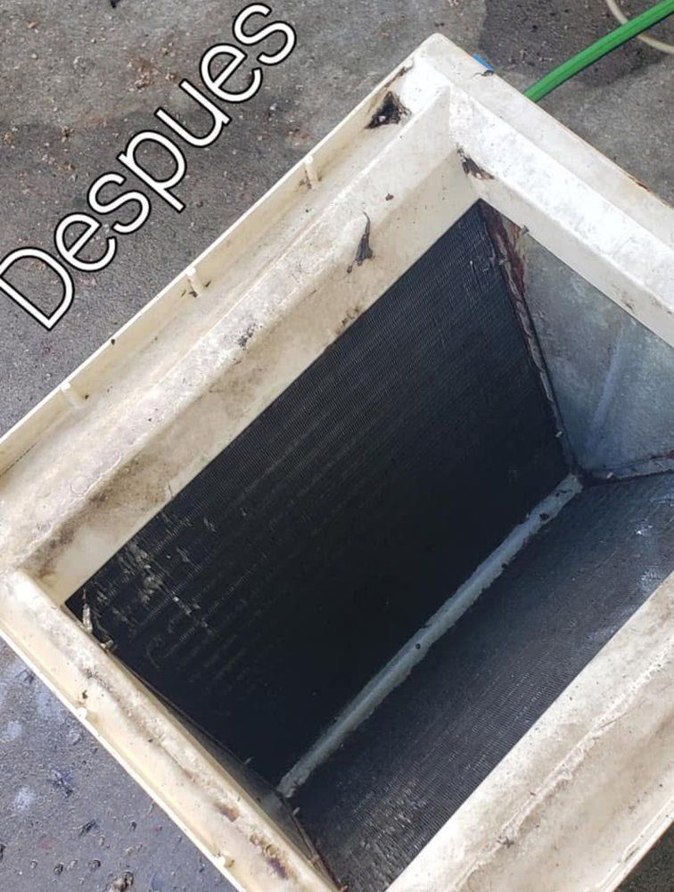 Cleaned rectangular air vent. Gray metal grill inside a white plastic frame.