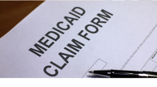 A medical aid claim form with a pen on it