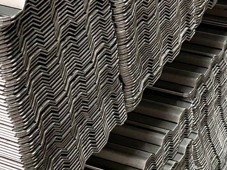 A close up of a stack of metal sheets stacked on top of each other.