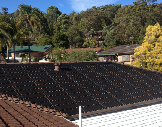 A Roof With a Lot of Solar Panels on It — Newcastle Solar Pool Heating Systems In Gosford, NSW