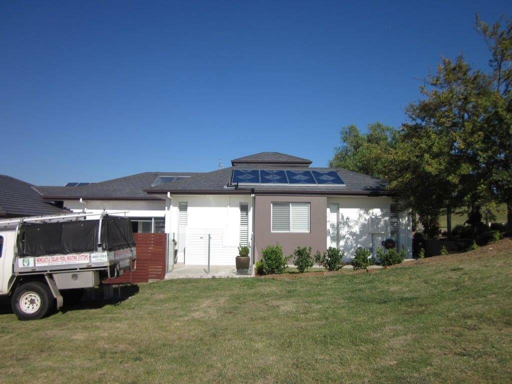A Truck is Parked With Solar Panels on the Roof — Newcastle Solar Pool Heating Systems In Elermore Vale, NSW