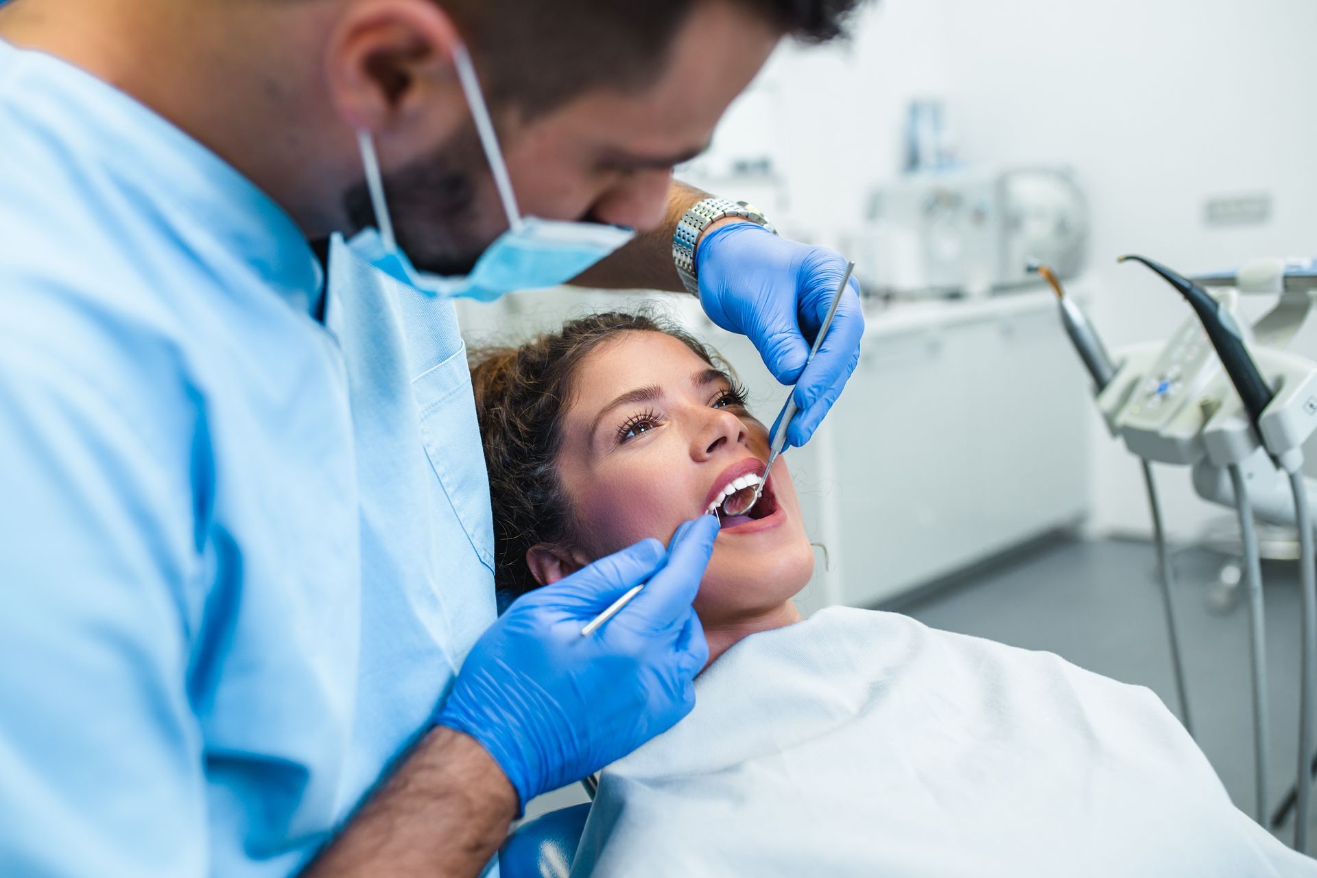  A dentist is treating a patient.