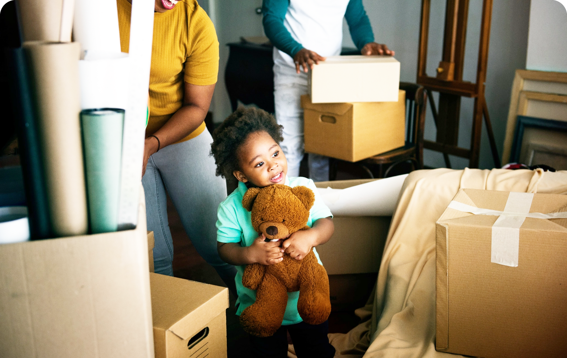 young boy holding a teddy bear