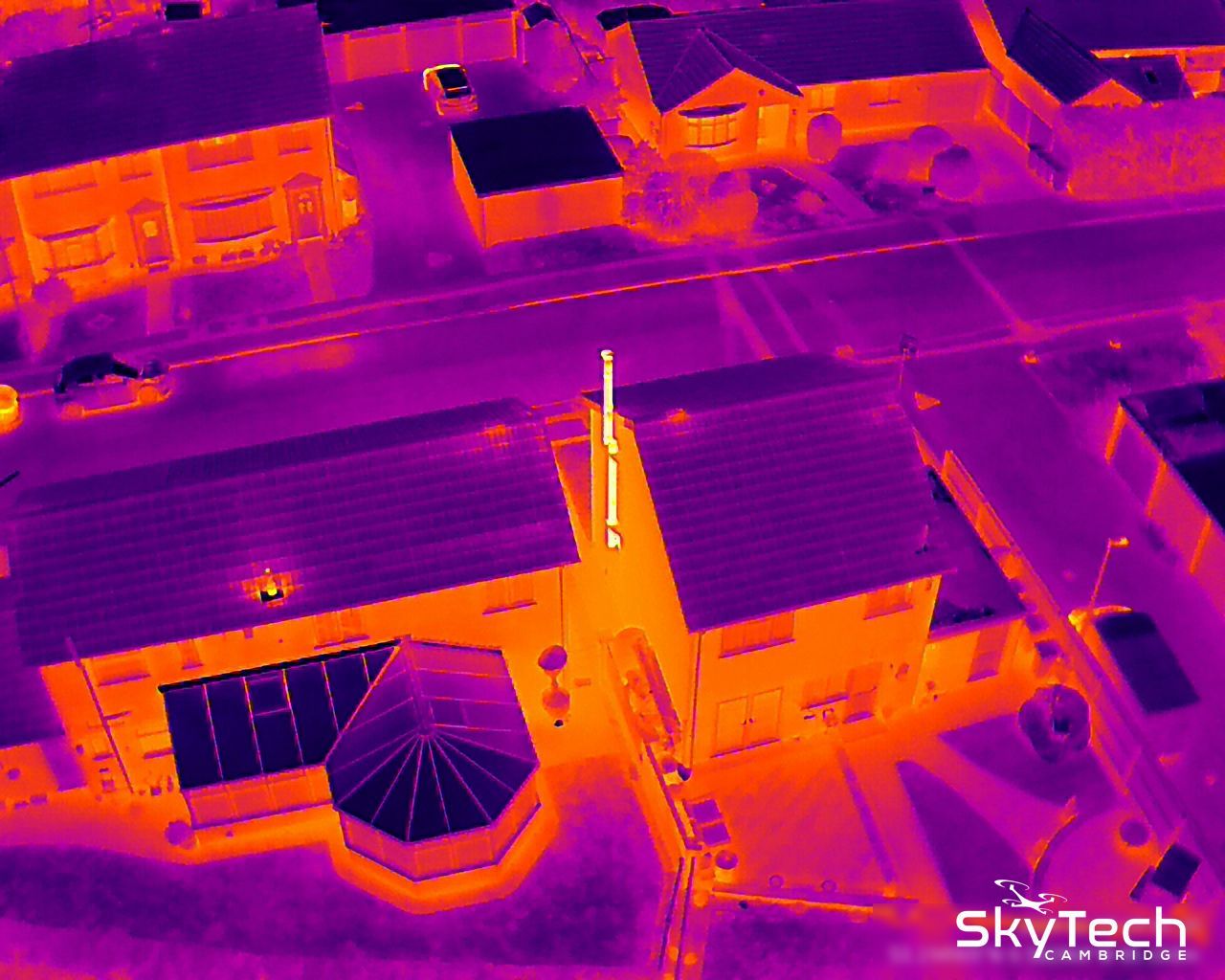 Drone thermal image showing the distinctive thermal signature of an external log burning flue