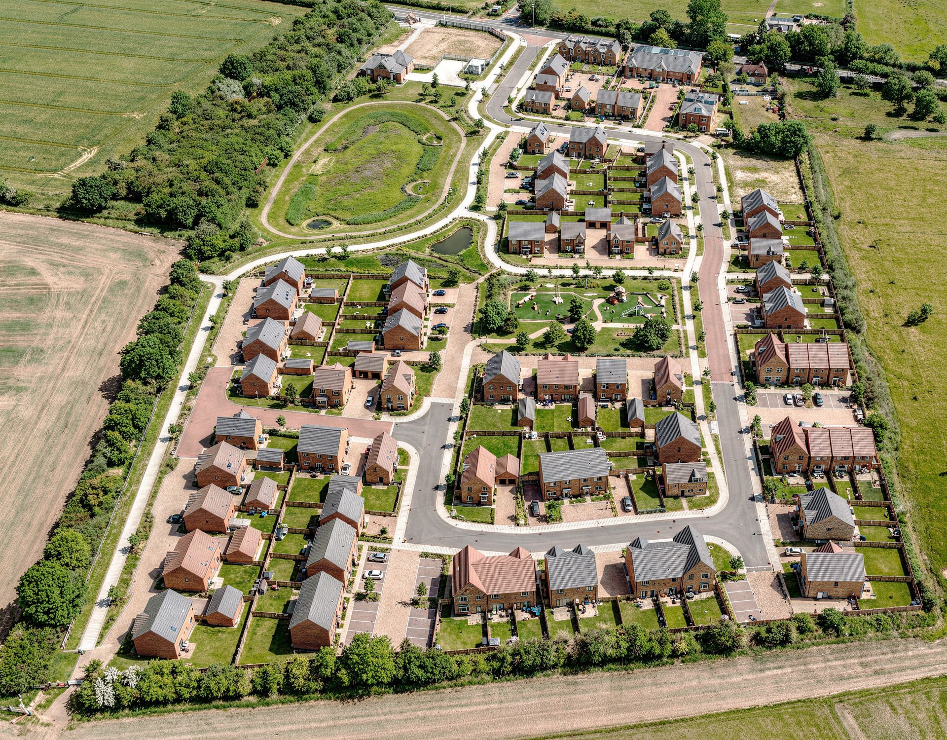 Rendered aerial visualisation of Bellway Hatton Gate development in Northstowe overlaid onto drone photo of the site