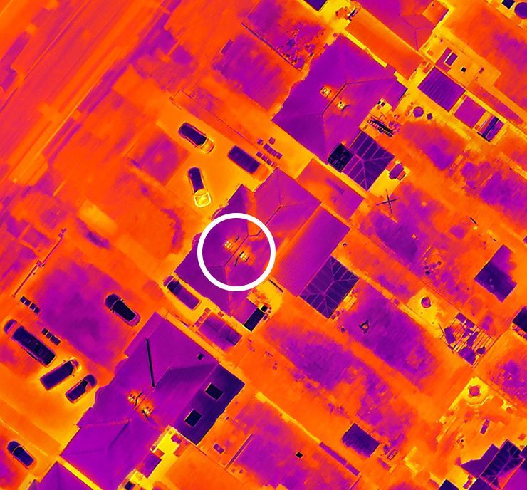 Drone thermal imaging photo showing an example of detecting active chimneys in a smoke control zone.