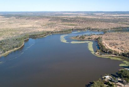 An Aerial View of a Large Body of Water Surrounded by Trees — Peter Maundrell & Company Pty Ltd in Clermont, QLD