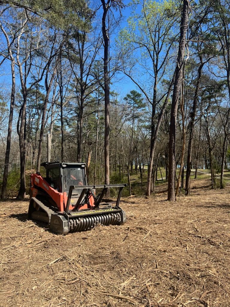 Family gathered at a dining table in a kitchen. They are eating and talking together.