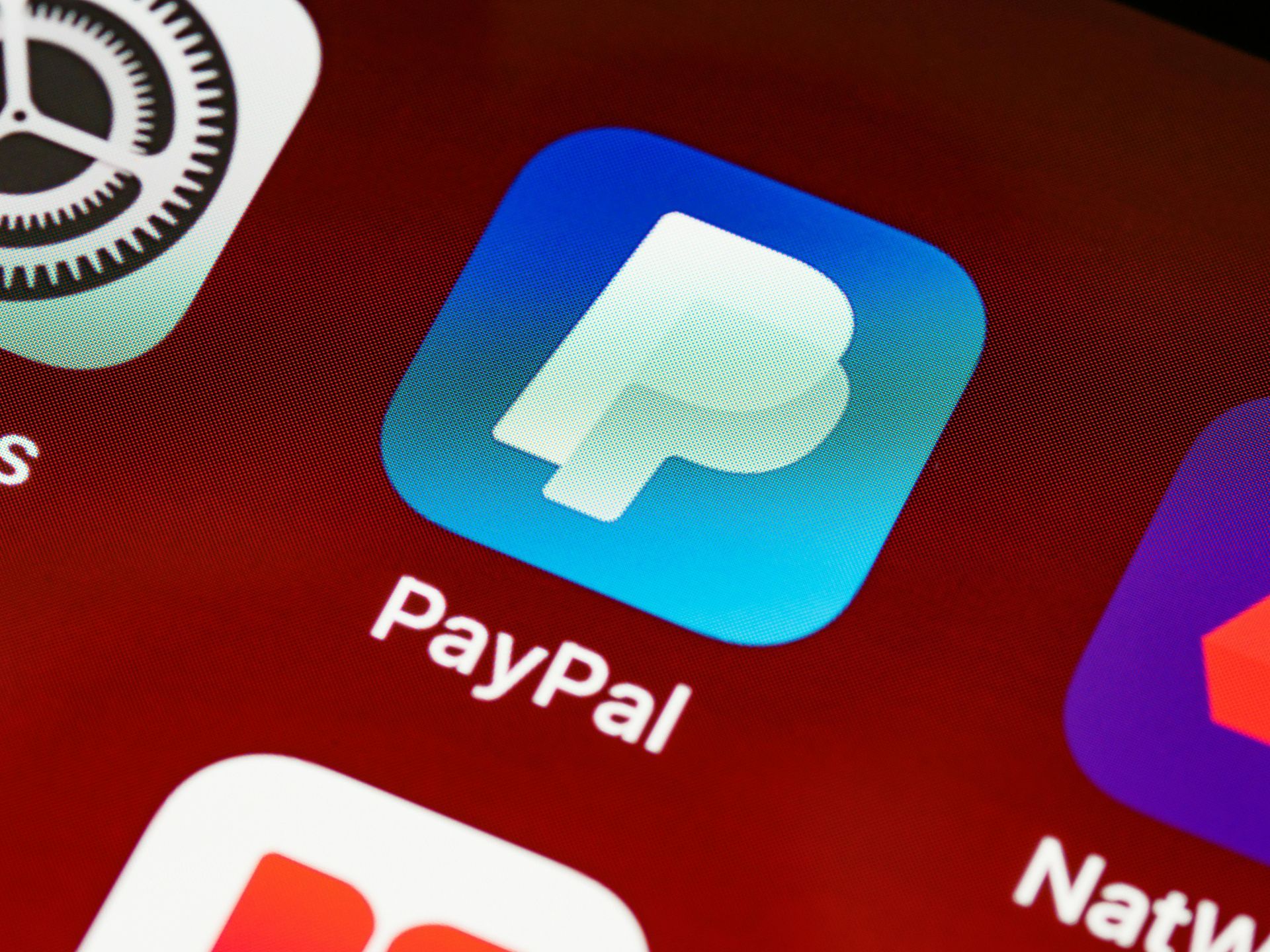 PayPal app icon on a smartphone screen, blue square with a white 