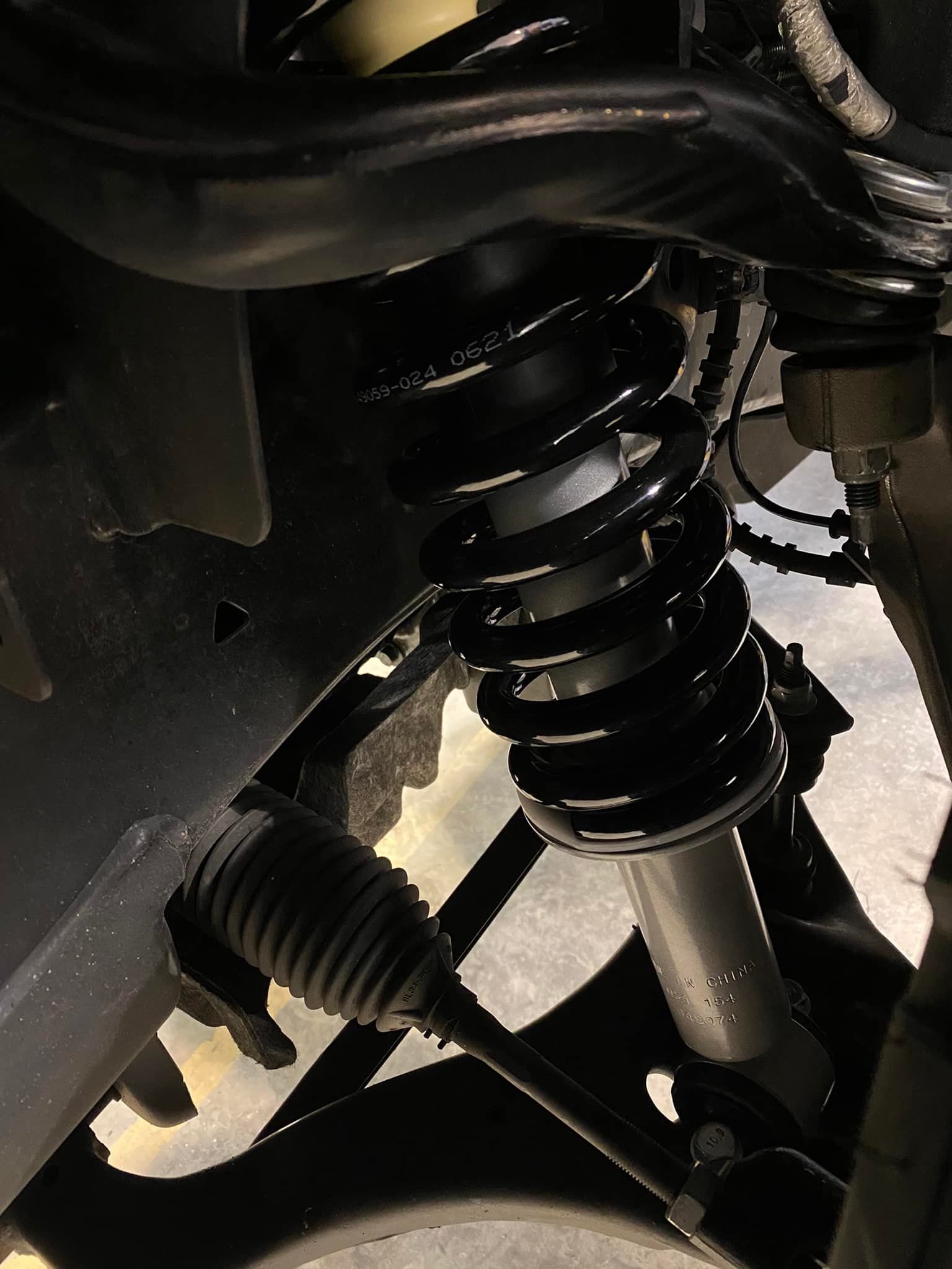 A Close up of a Shock Absorber on a Car | Apex Vehicle Services