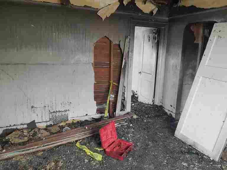 A photo of a fire damaged house in California, ready for sale to those looking to sell fire damaged house in California.