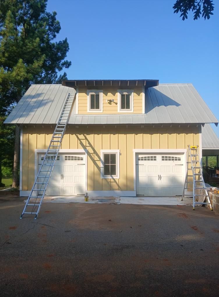 A yellow house with a ladder on the side of it
