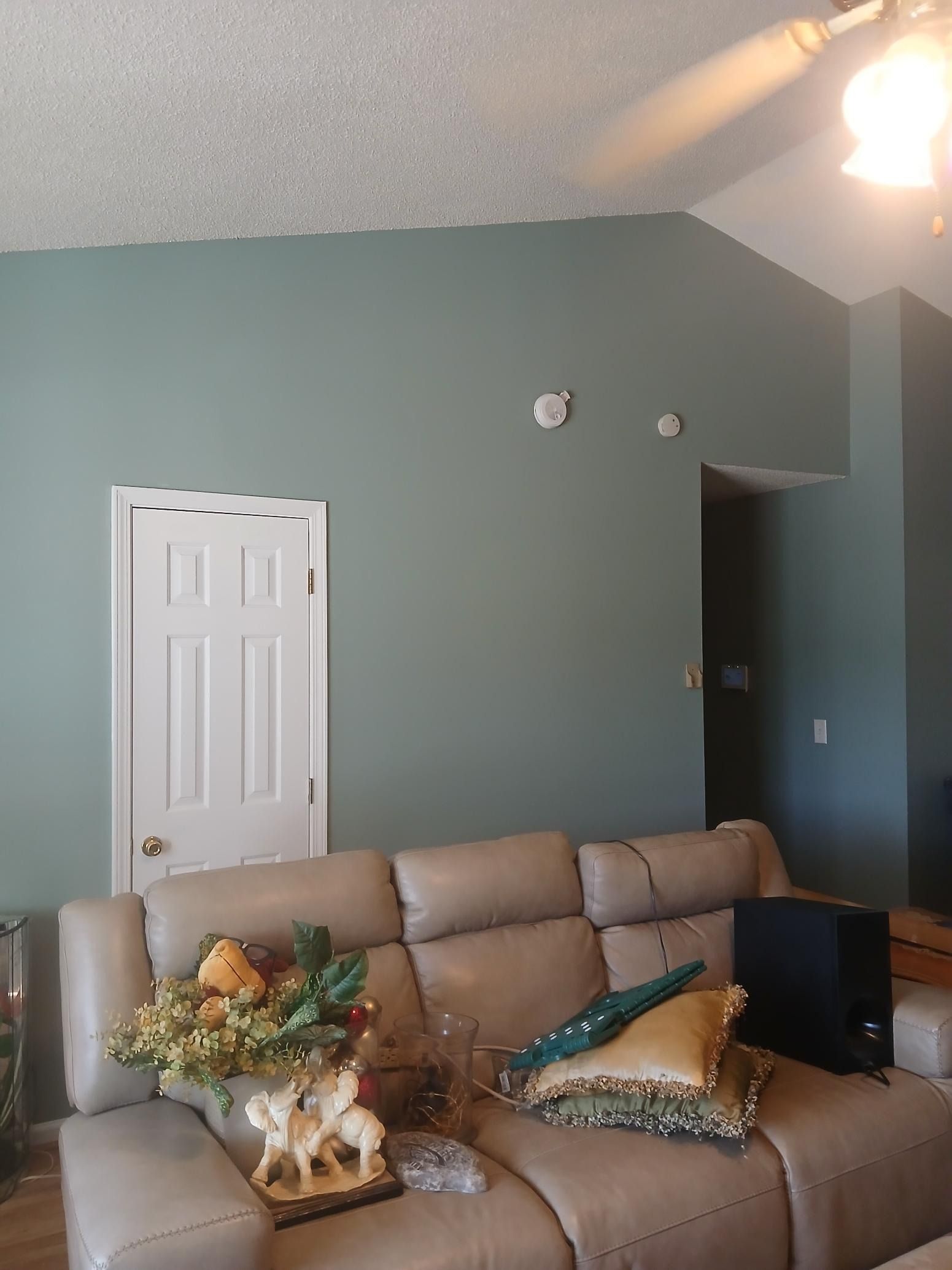 A living room with a couch and a door