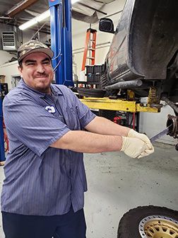 Maro-working-on-tire| Auto Tec LLC