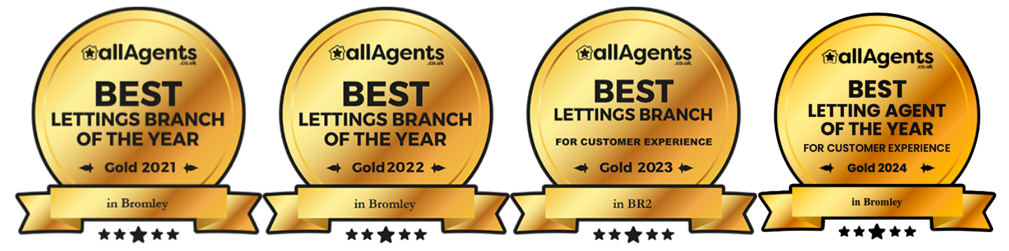 Four gold plaques that say best lettings branch of the year