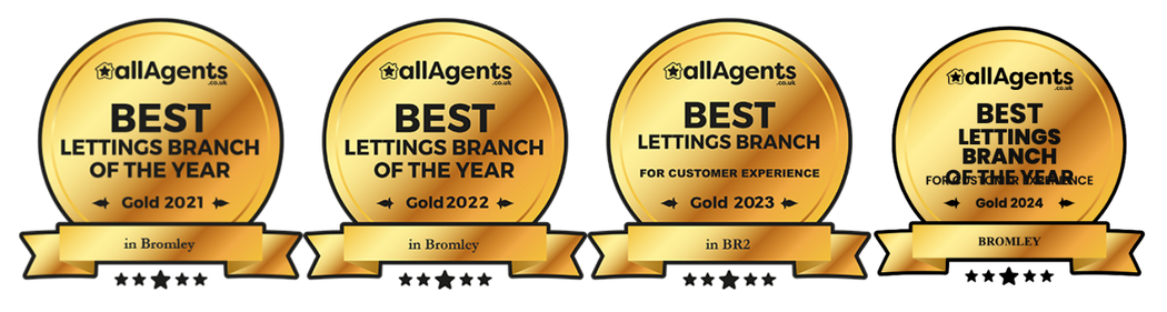 Four gold plaques that say best lettings branch of the year