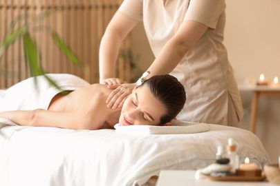 A woman is getting a massage at a spa.