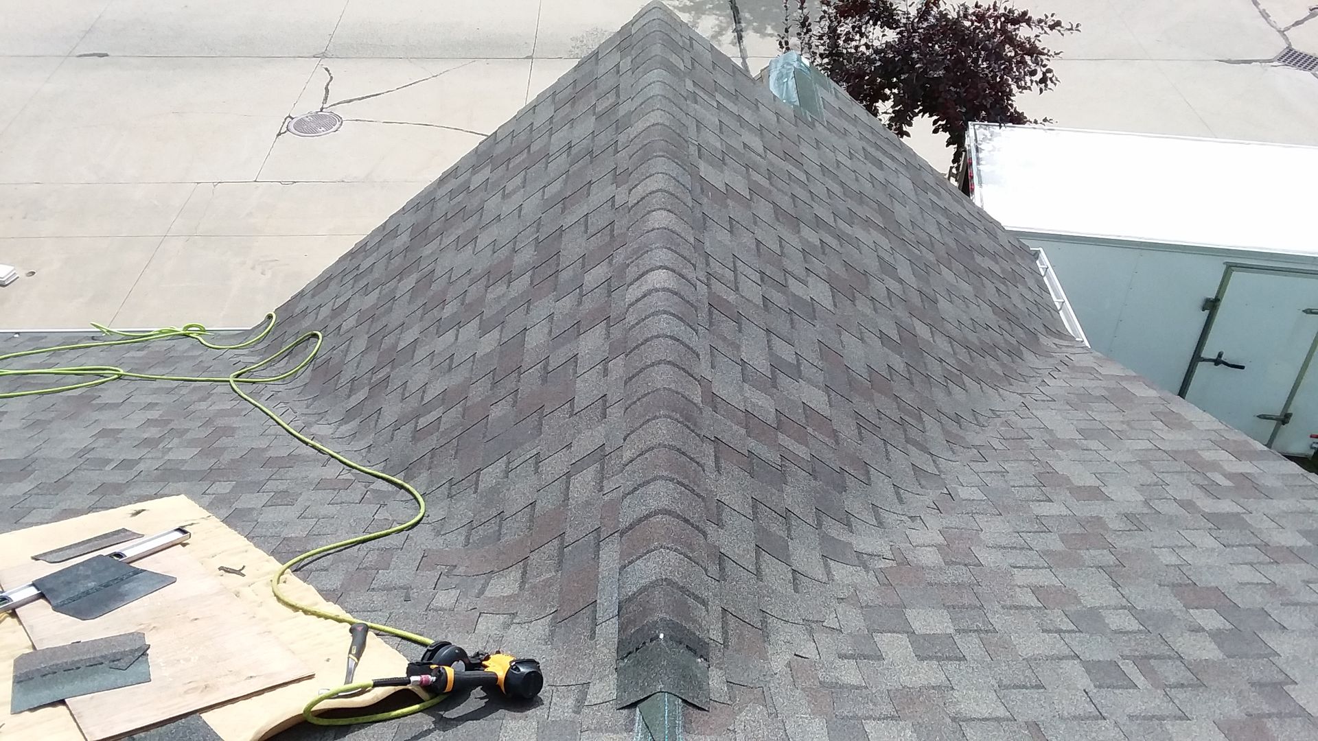 Landmark Dimensional Shingles in color Weathered Wood Being Installed on a Residential Roof in Moorhead, MN