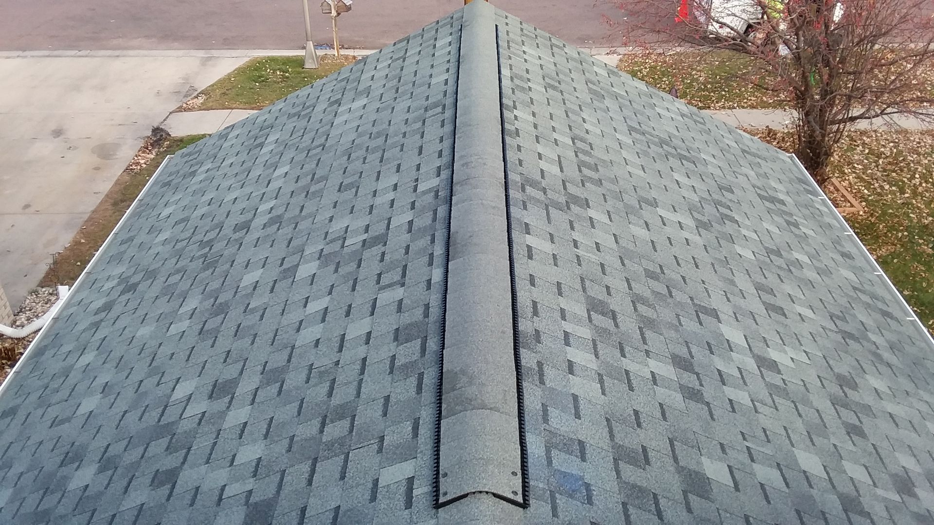 Lomanco Low Profile Shingle over Ridge Vent Installed on a Roof near Davenport, ND