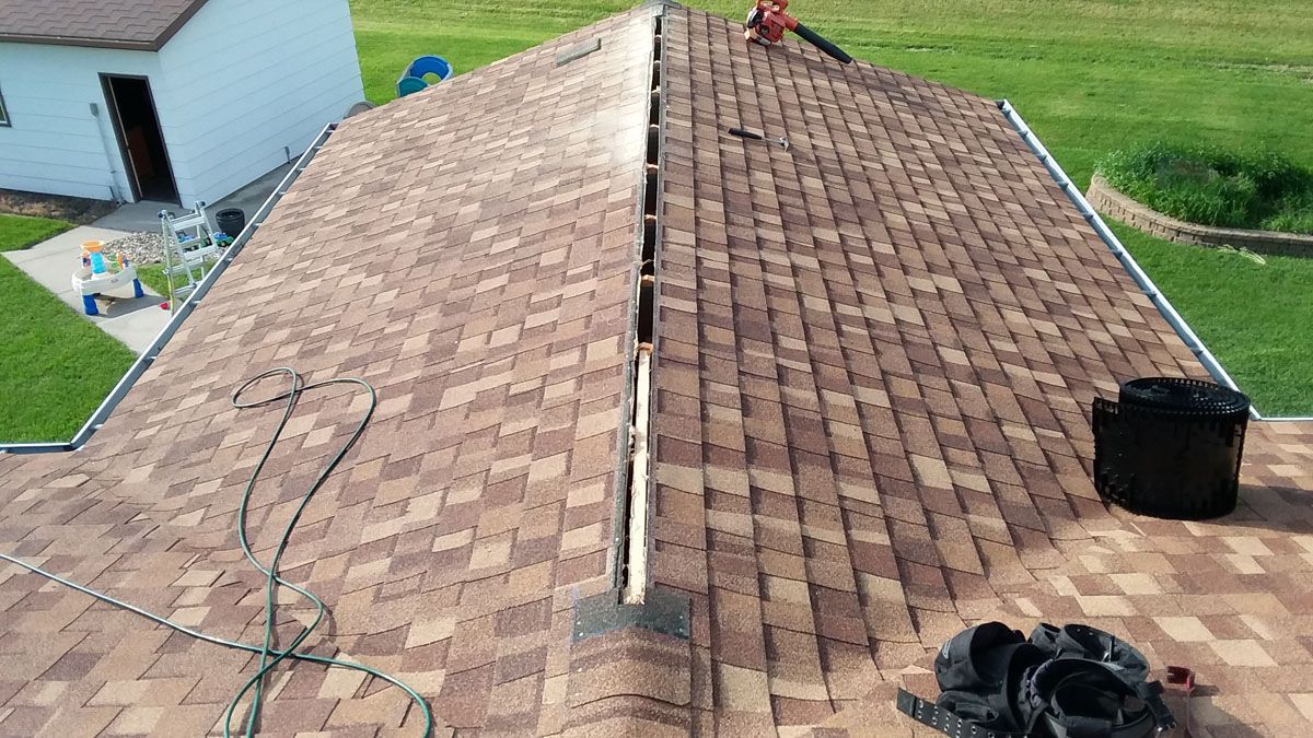 CertainTeed Shingle Roof with Roof Peak Cut Open for Ridge Vent near Hatton, ND