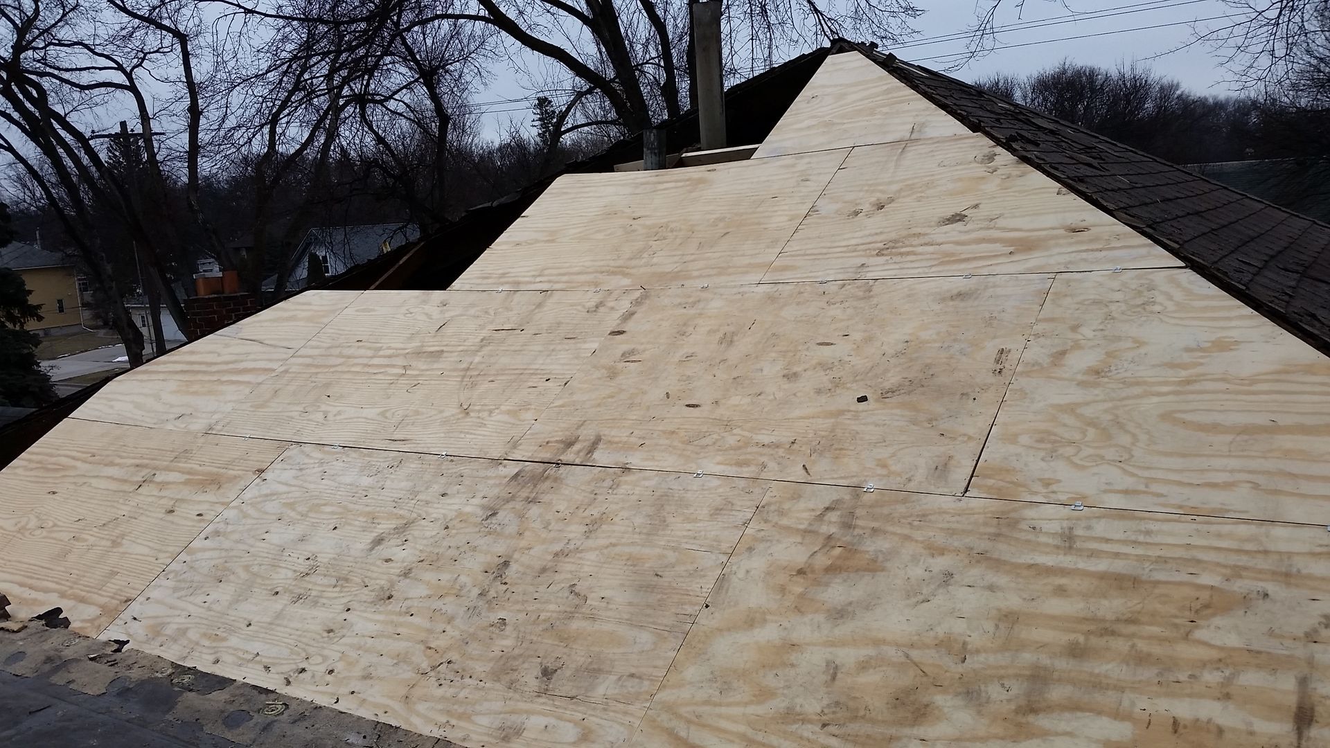 Roof Decking being Installed on a Hip and Ridge Framed Structure in Argusville ND