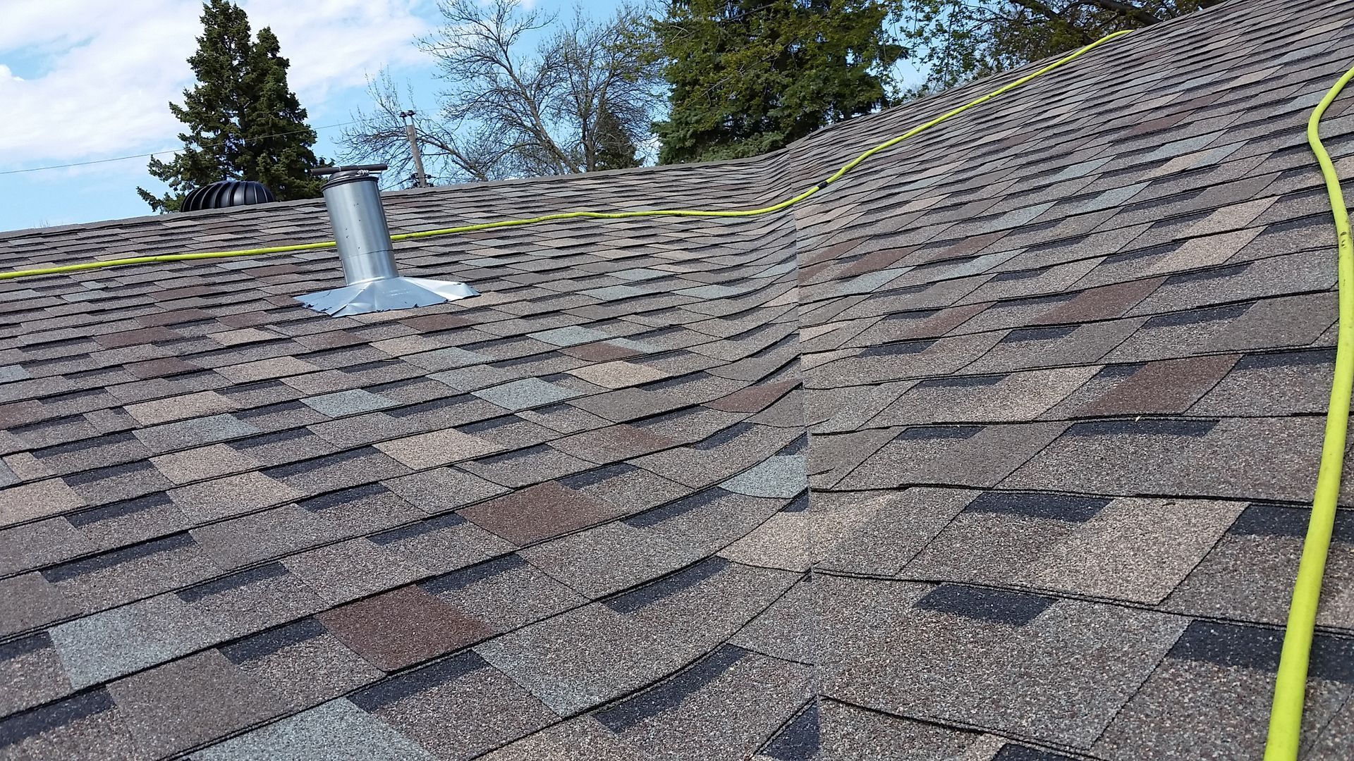 Briarwood Asphalt Roofing Shingles and Frostproof Sewer Pipe Flashing Installed in New York Mills-MN