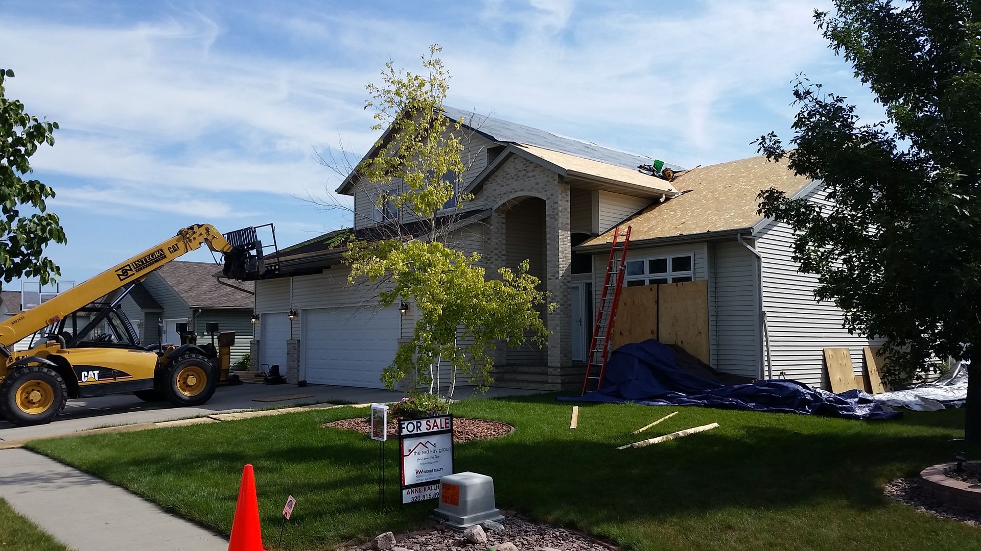 Roofing Business Removing Nails and Tar Paper Felt Underlayment with Forklift in West-Fargo-North-Dakota
