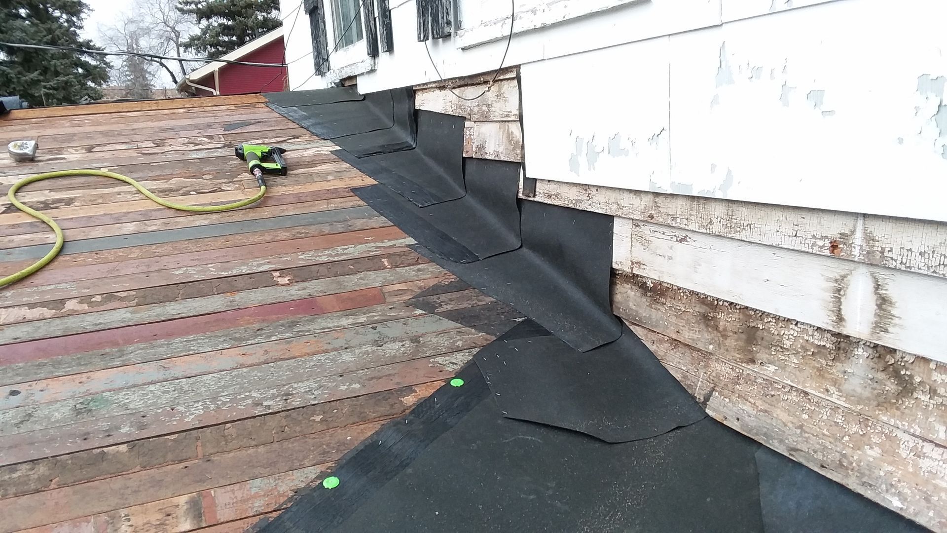 Ice & Water Barrier Guard Protector at Wall Area Before Installing Atlas Shingles in Horace, ND