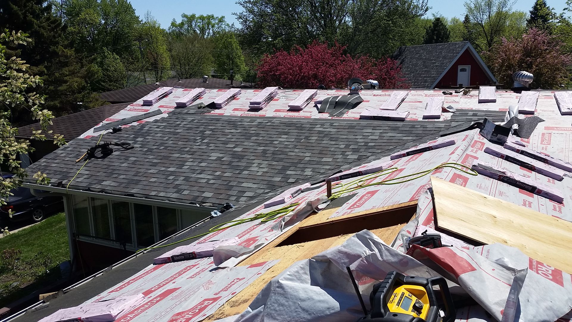 Owens Corning Asphalt Roofing Shingles Halfway Installed in West Fargo-ND