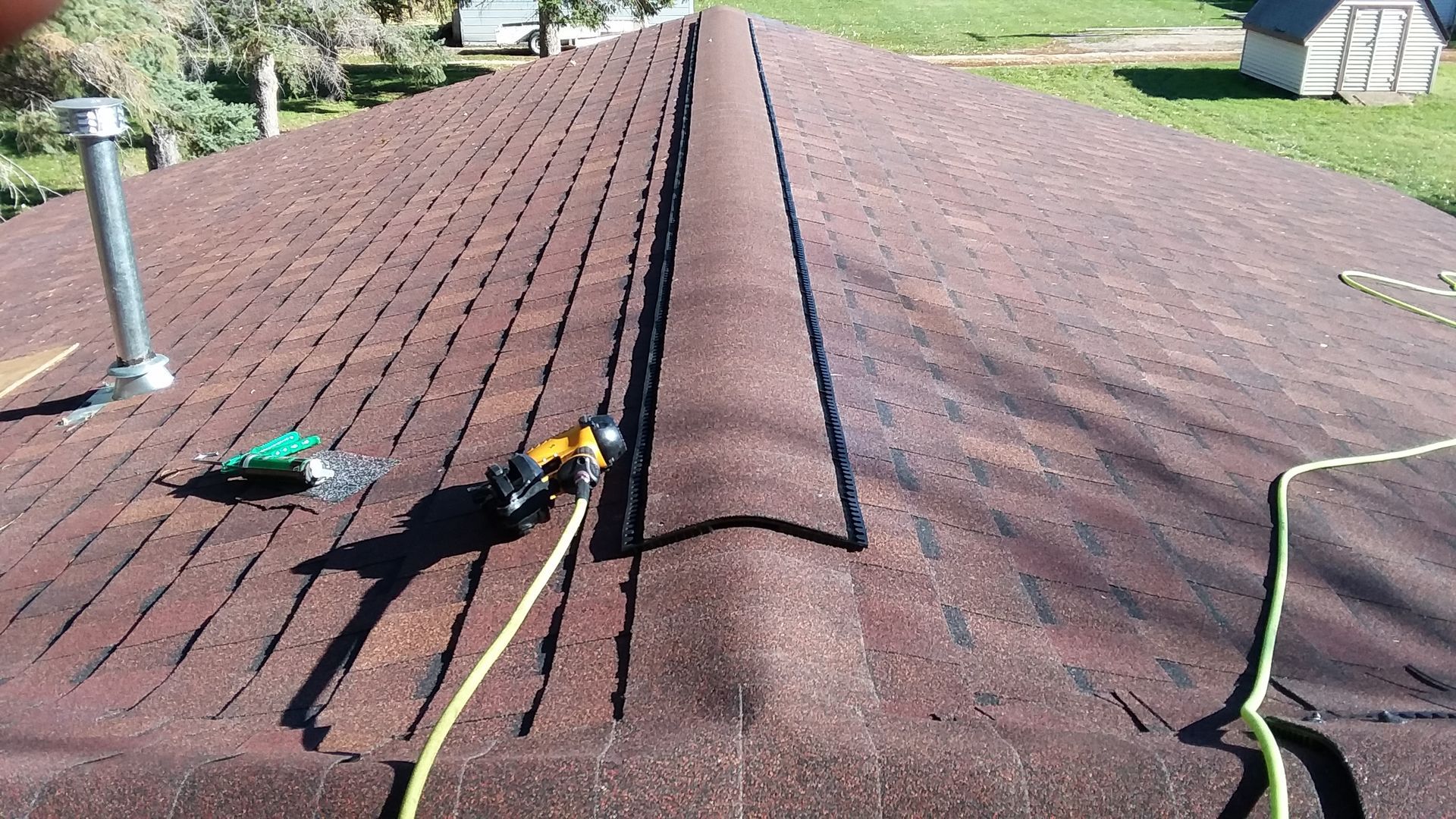 Stanley Roofing Air Tool next To Lomanco Low Profile Ridge Vent in Dilworth, MN