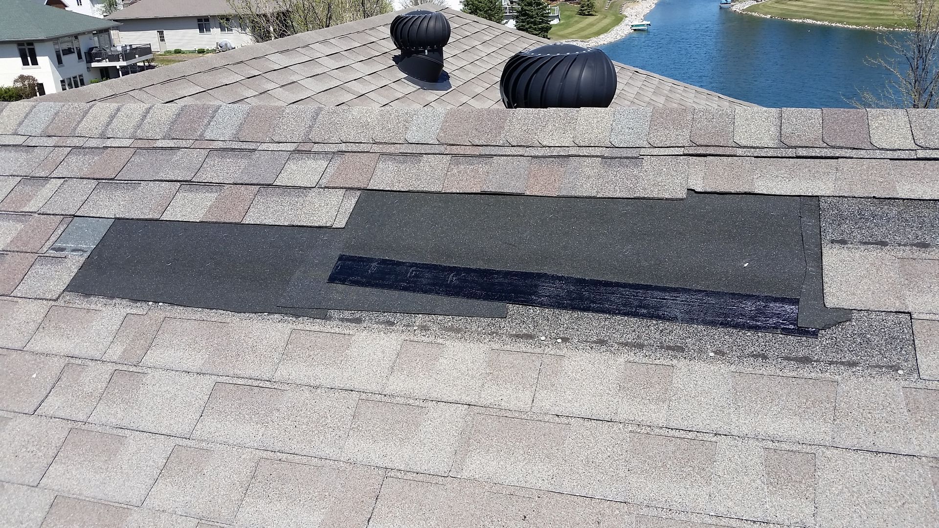 Shingles by Peak of Roof Being Repaired near Glyndon, MN