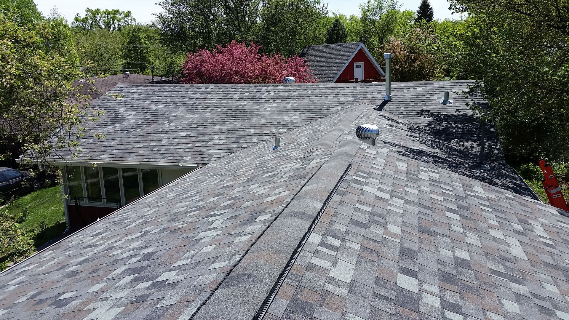 Shingle roof replaced after hail and windstorm damage near Grand Forks, North Dakota