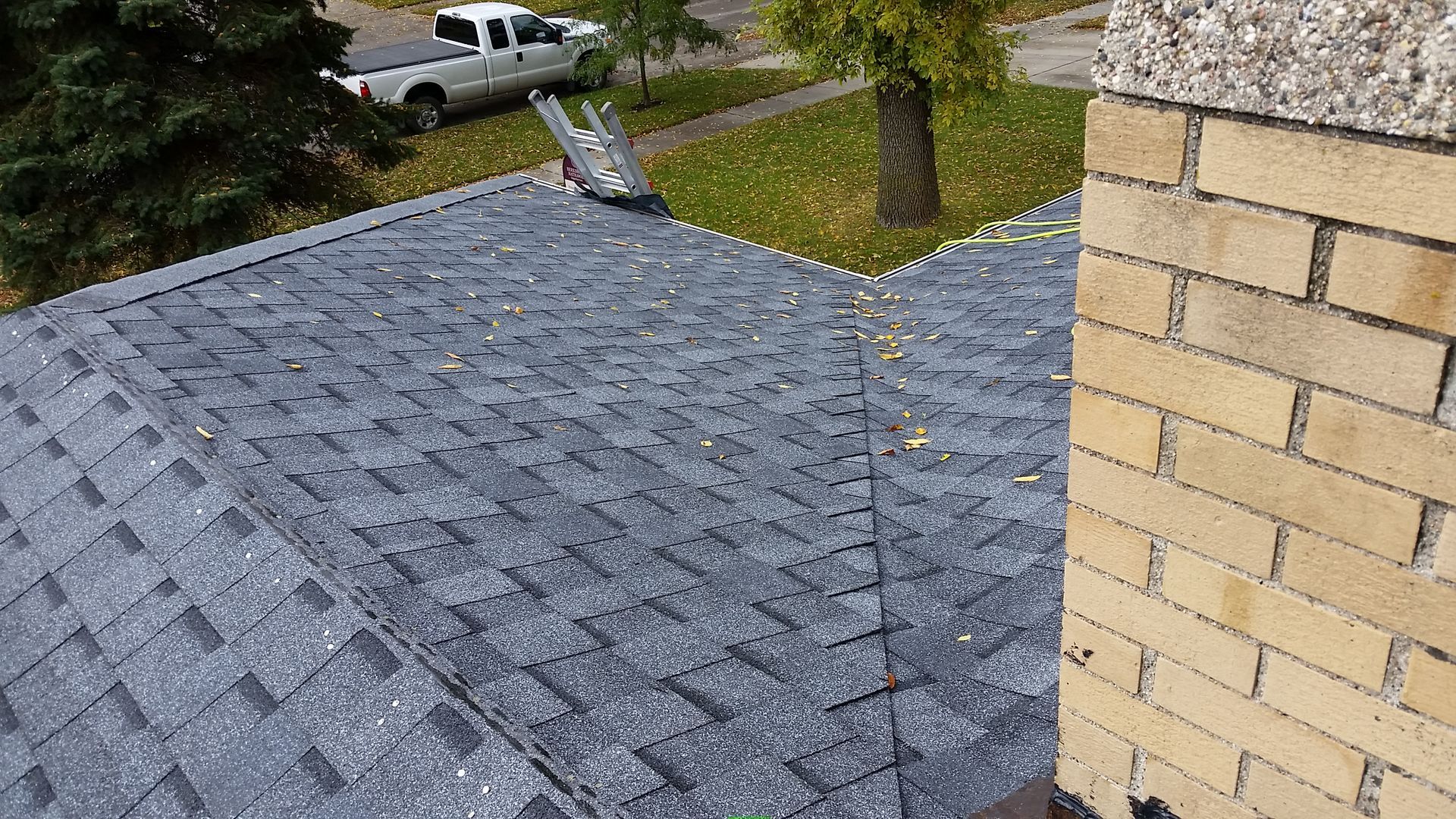 Atlas Brand Shingles Installed with a Closed Roof Valley and Chimney Flashing in Becker-County-MN