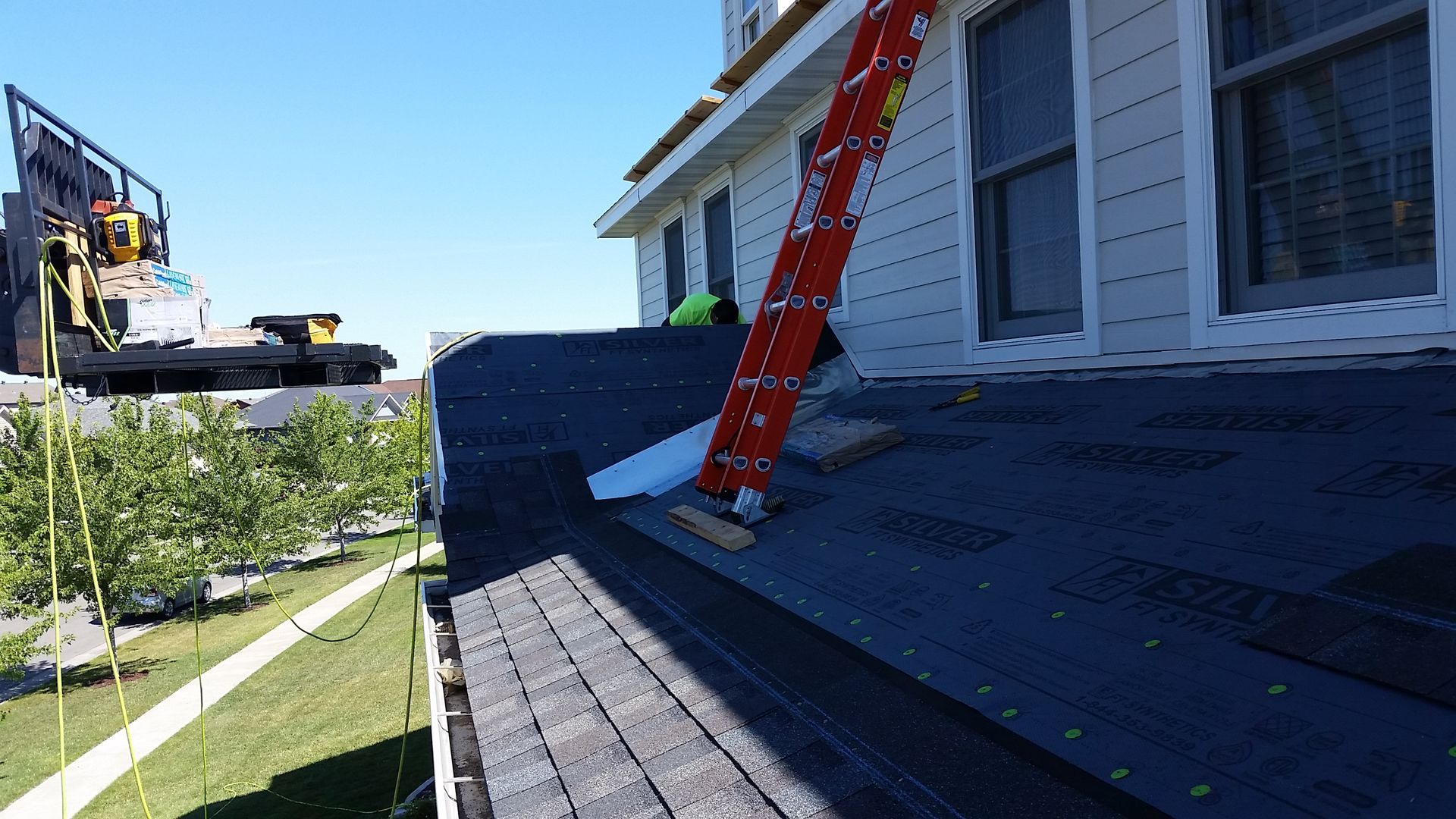 Shingles Being Installed on Top of Porch Roof with Exposed Underlayment in Cormorant-MN