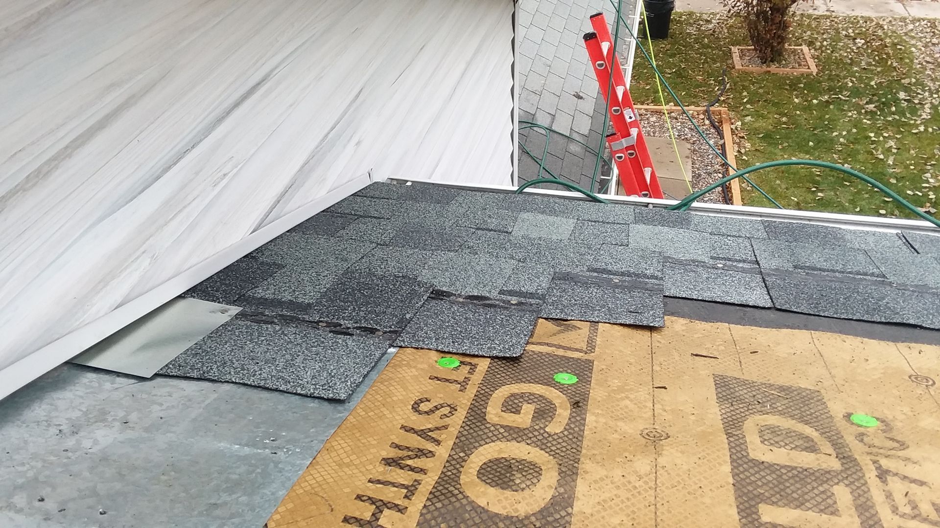 Atlas Roofing Shingles being Installed with Metal Step Flashing in Oxbow, ND