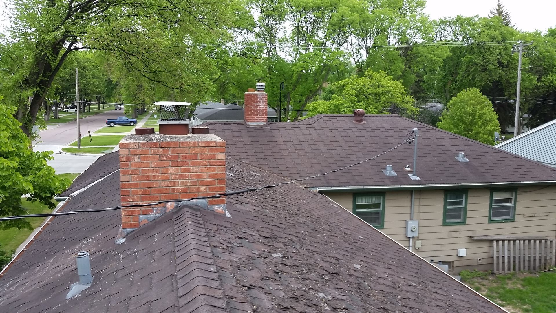 Residential Home with Old Curled up Asphalt Roof Shingles in Underwood-MN