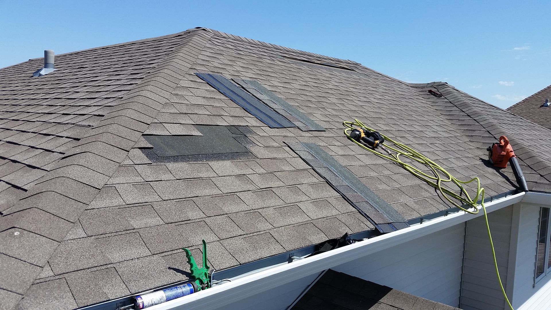 Damaged Roof Shingles Being Removed and Replaced with Tools in Wilkin-County-MN