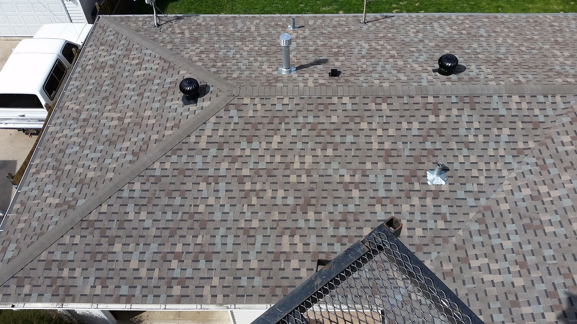 High up View of Roof with Whirlybird Turbine Vents and Gas Vent Flashing in Dent-MN