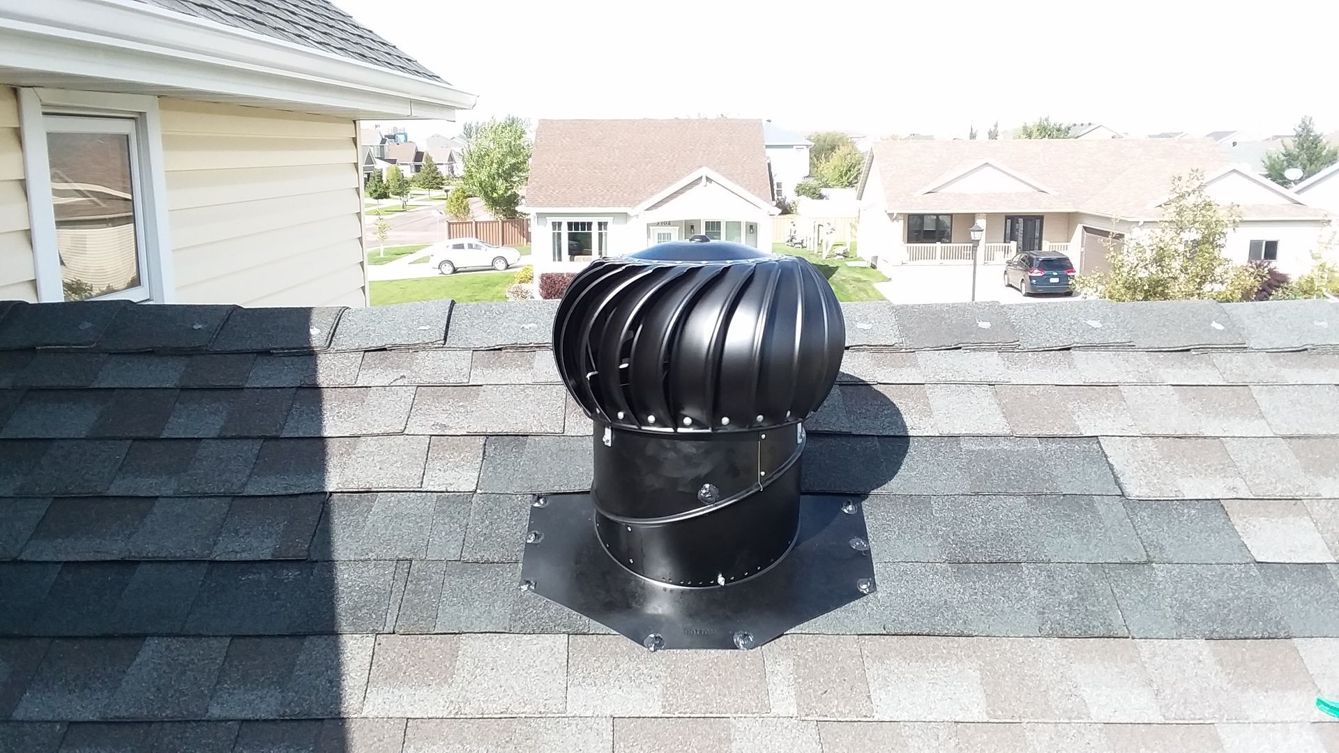 Whirlybird Turbine Exhaust Vent Installed for a Roof Repair with Black Shingles near Ottertail, MN