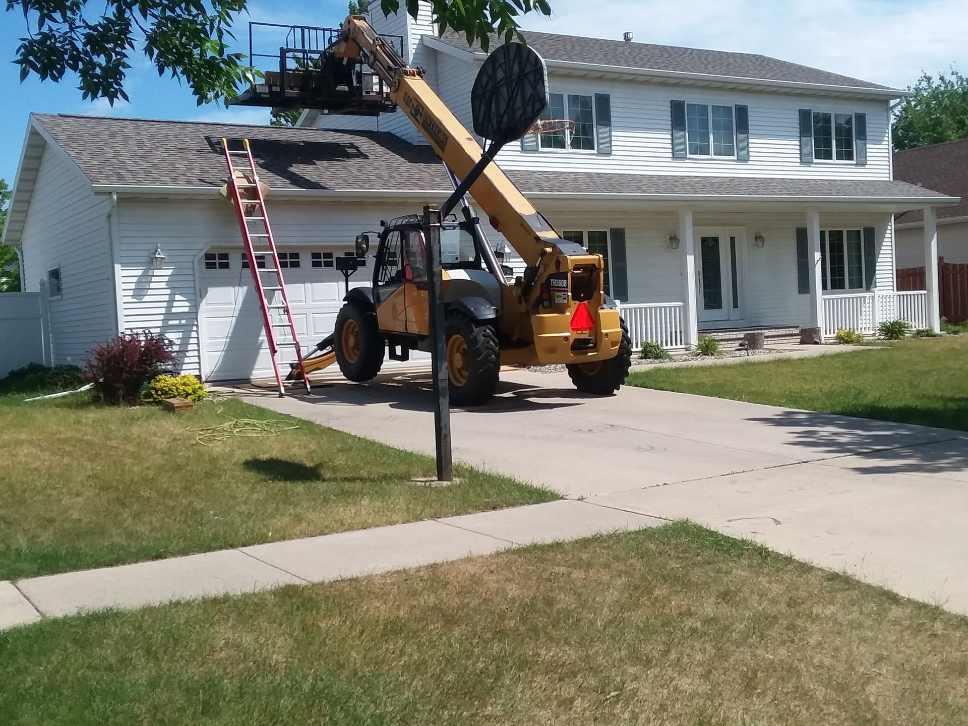Using Forklift to Lift Roofing Material to Eave in Wahpeton-North-Dakota