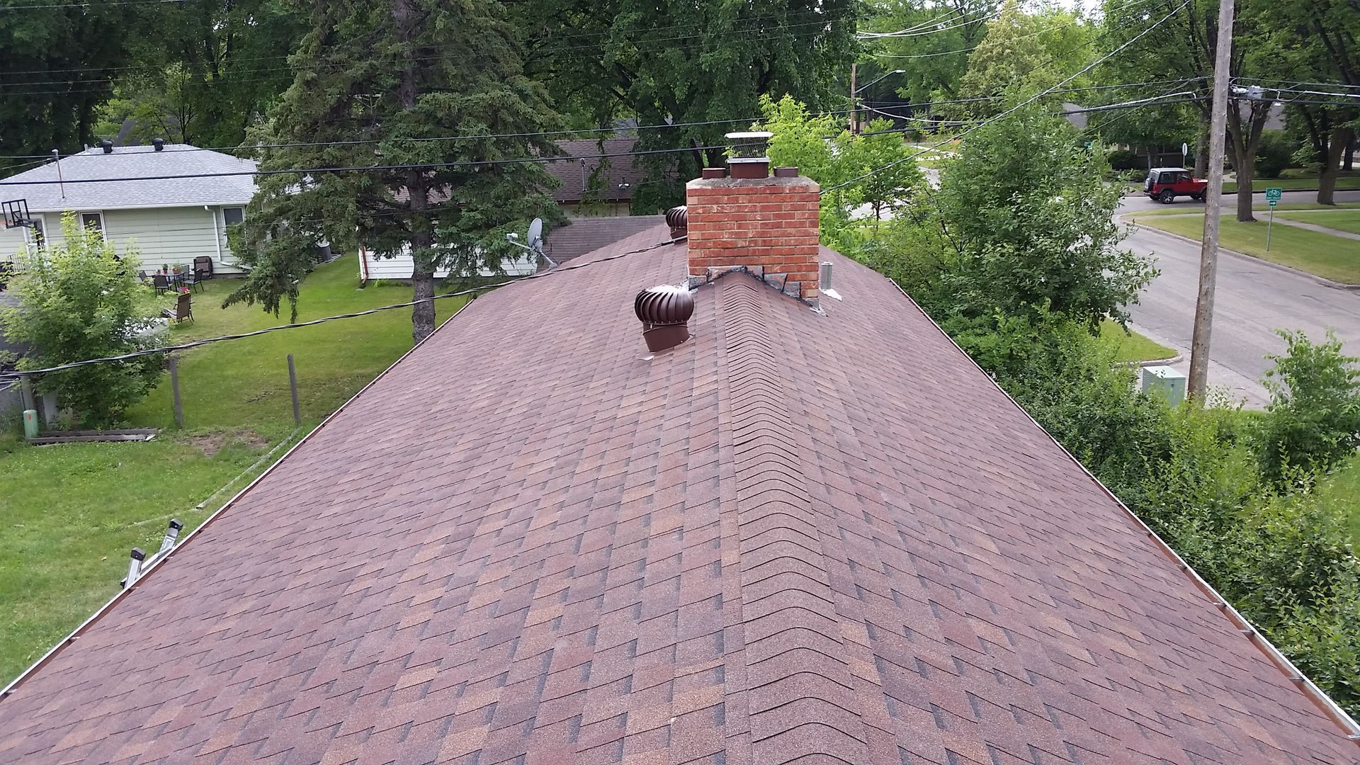 Roof Completed with a Brick Chimney and Whirlybird Vents near Lake Park Minnesota
