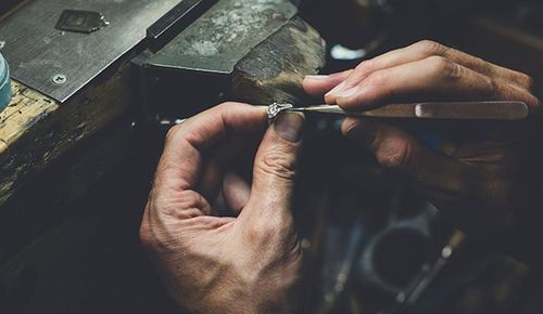 Hands Working on Diamond Ring — Ringgold, GA — The Vault Coin & Jewelry