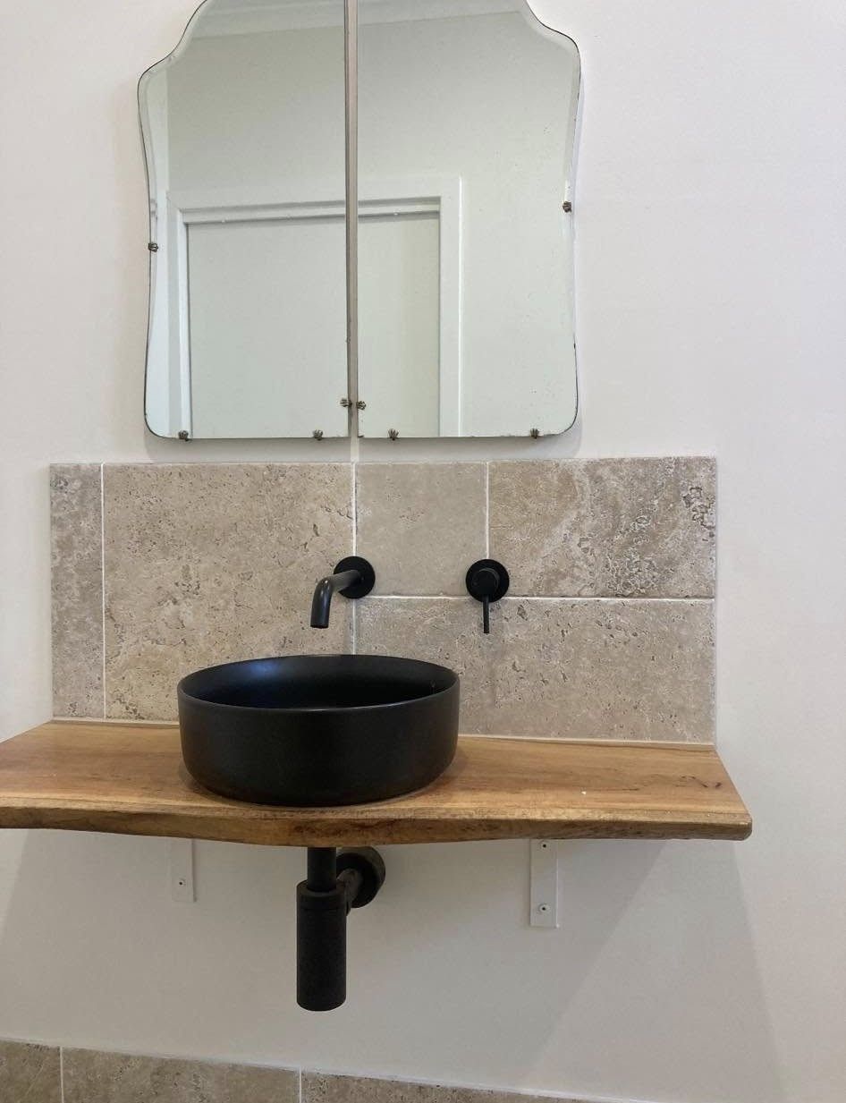 Black Basin Sink With Faucet, Tile Backsplash, And Ornate Mirror — BJG Plumbing in Coolamon, NSW