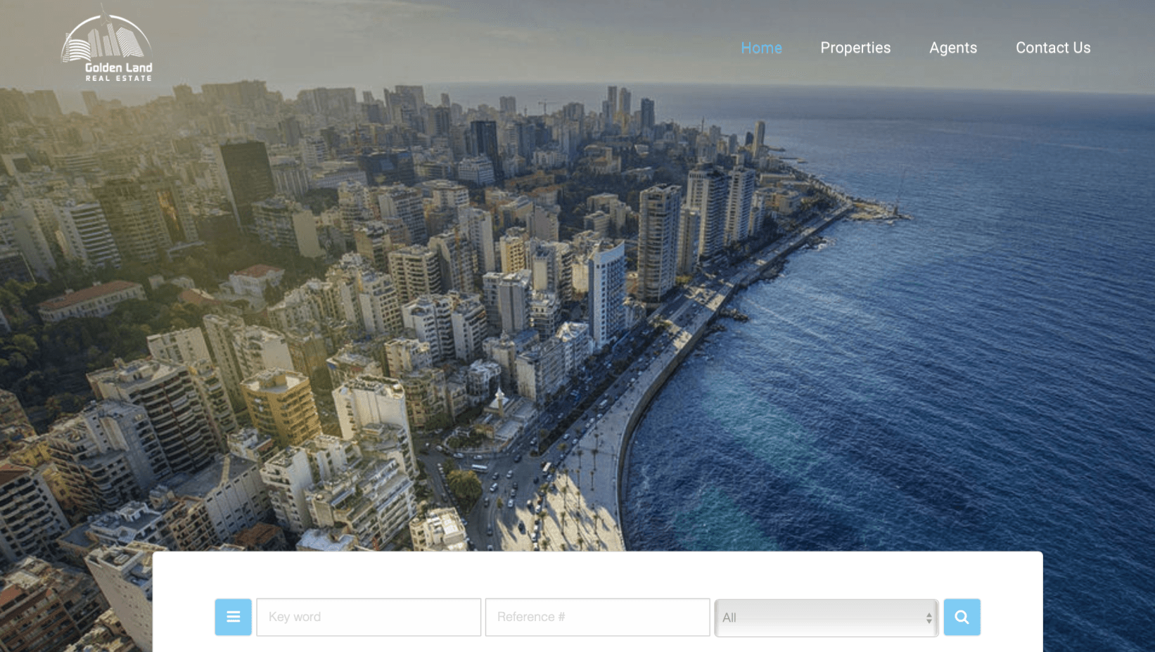 An aerial view of a city next to the ocean on a website.