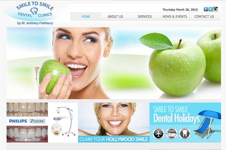 A woman is smiling while holding a green apple