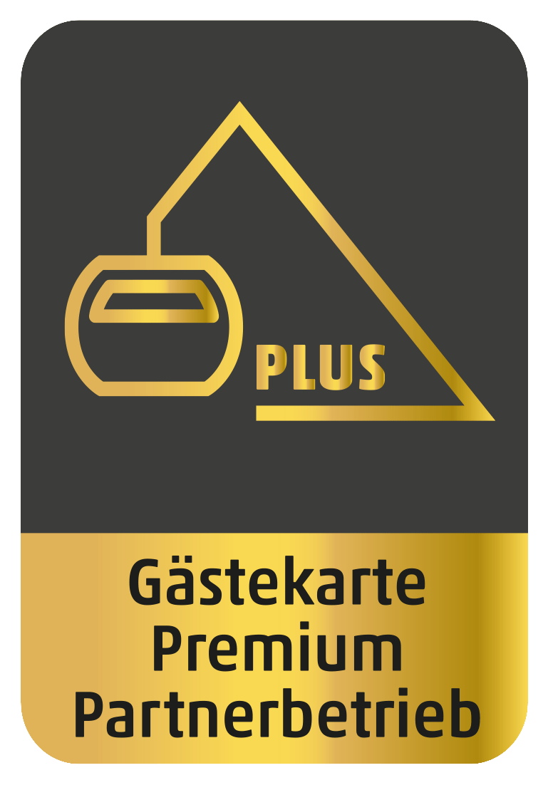 A gold and black logo that says gästekarte premium partnerbetrieb