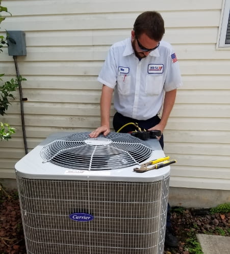 Mid-Florida Heating & Air working on AC unit repair