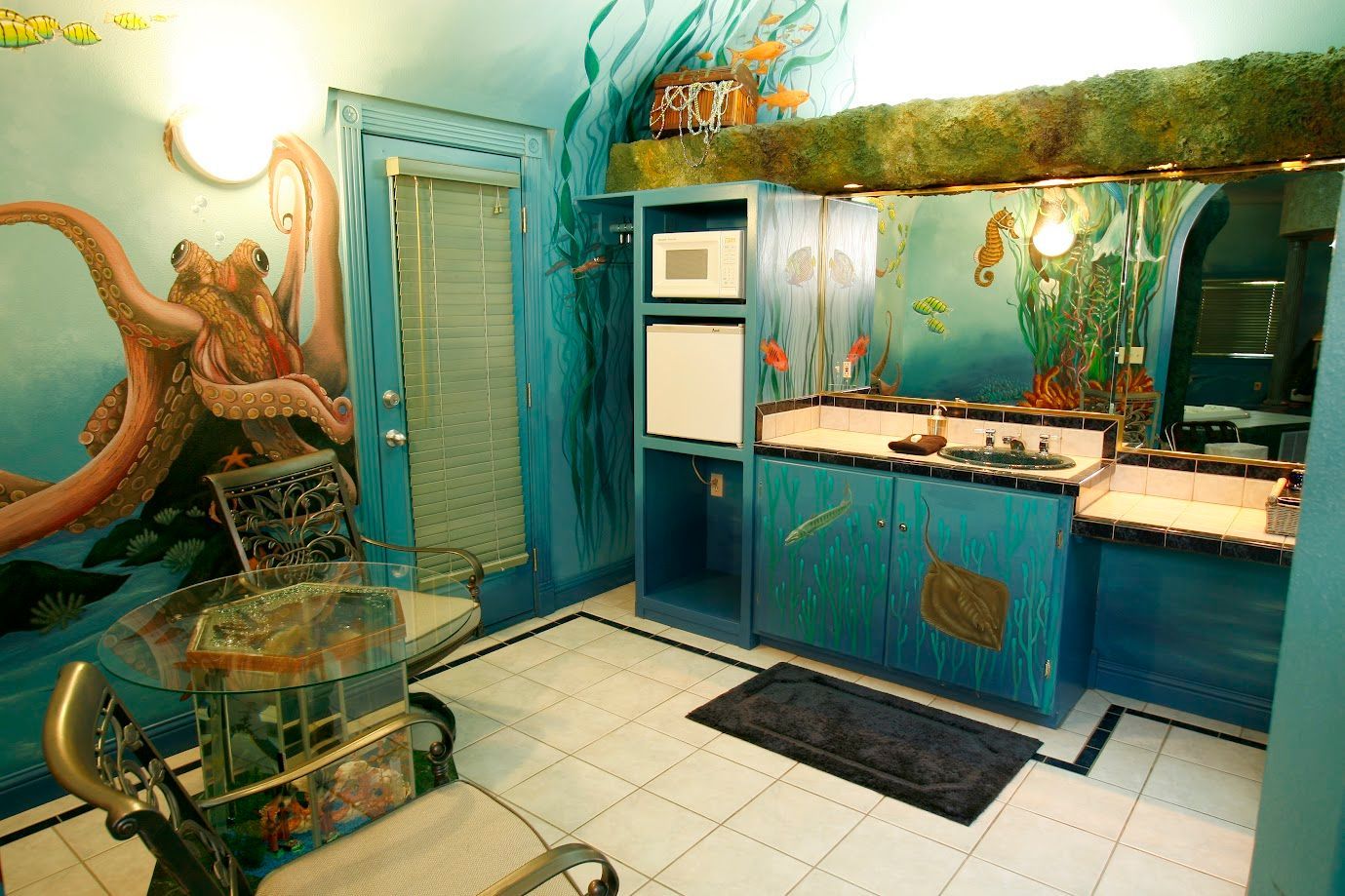 A bathroom with a painting of an octopus on the wall