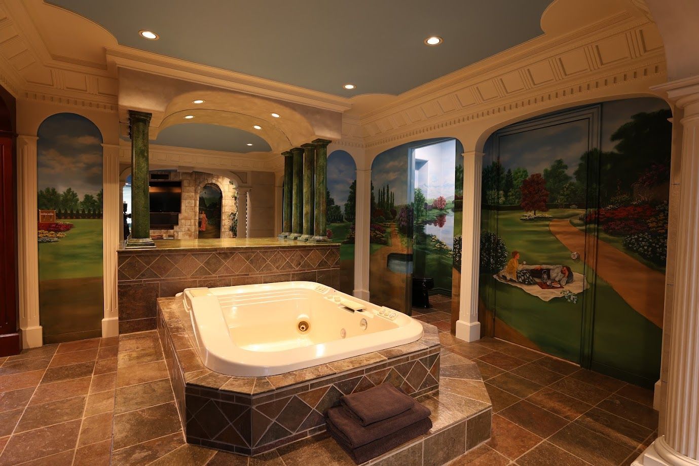 There is a large jacuzzi tub in the middle of the bathroom.